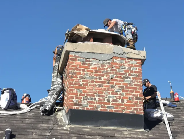 Kendall Chimney Sweep installing a custom chimney crown in Kendall, FL