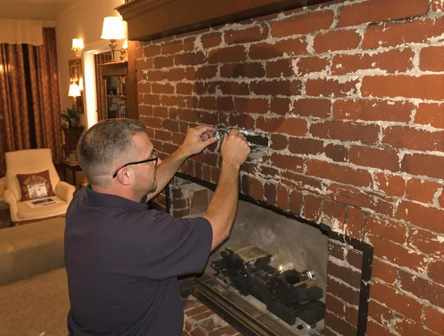 Kendall Chimney Sweep expert fixing a fireplace in Kendall, FL